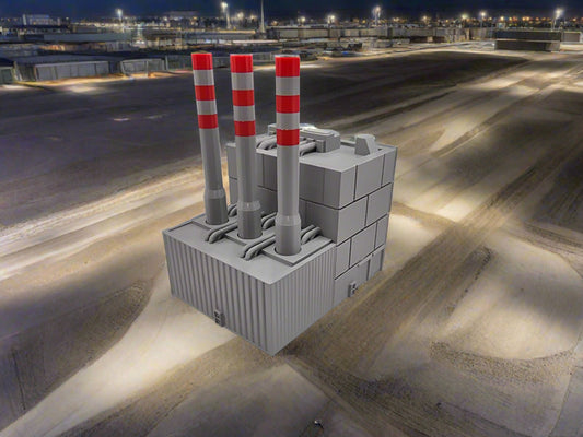 Model of a power plant with smokestacks on gravel lot