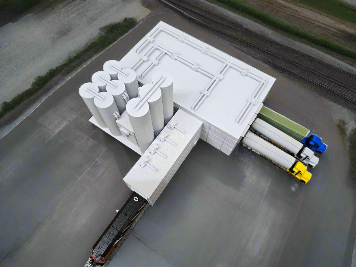 Model of a power plant with a train on a grassy field