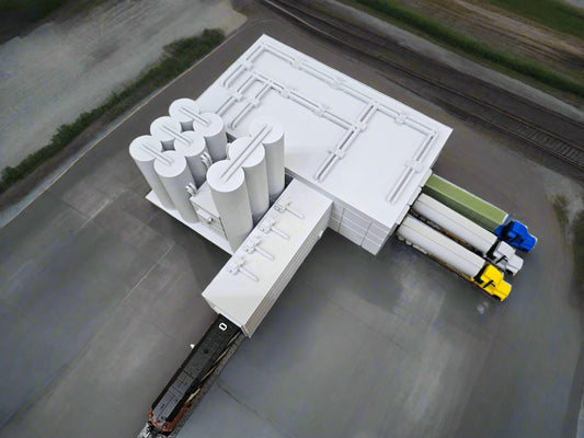 Model of a power plant with a train on a grassy field