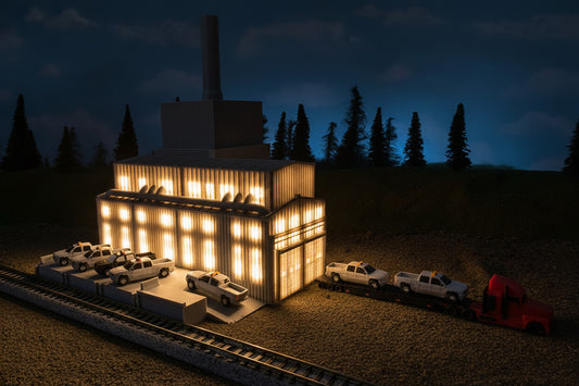 model of a car plant lighted at night time.