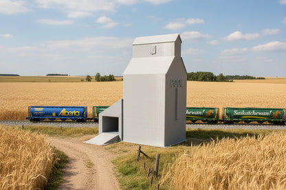 A Z Scale Grain Elevator model train set piece placed on a track with a blue sky and trees in the background.