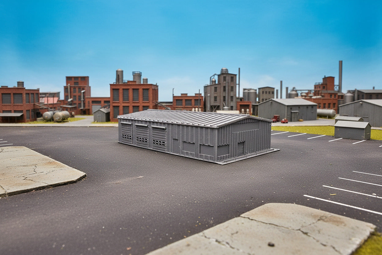 Model of a storage shed on grass with trees and sky in the background