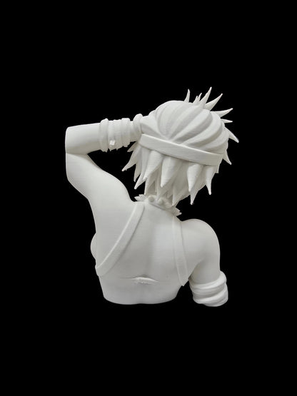 A white resin figurine of a female anime character with spiky hair, shown from behind, standing on a white display base in front of a brown bookshelf filled with books.