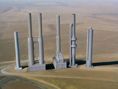 Set of gray 3D-printed models on a white surface with a beige wall background