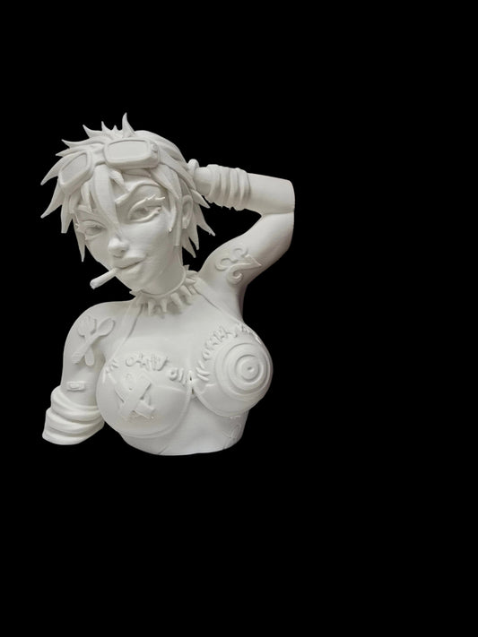 A white ceramic anime bust figurine of a tattooed woman with goggles, holding a book between her shoulder and arm, displayed on a shelf next to dark brown books.