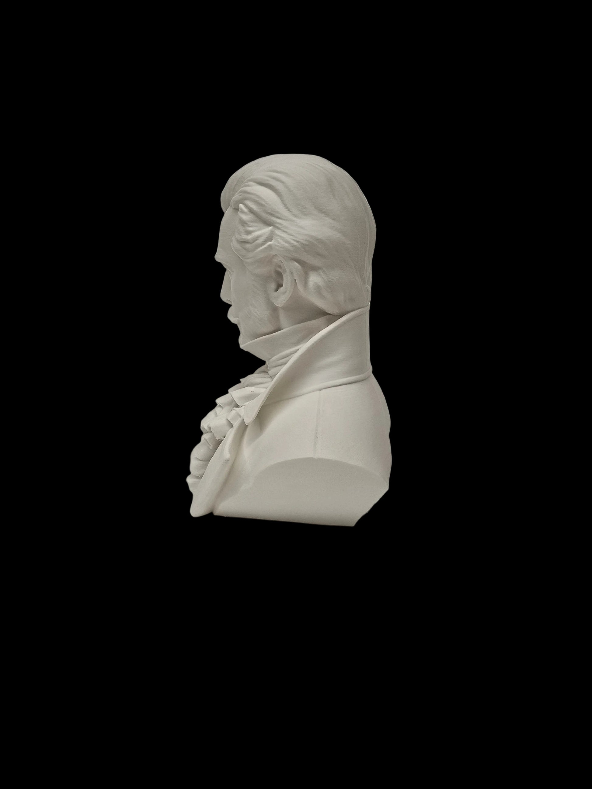 A white resin or ceramic bust sculpture of a historical man in profile, shown on a textured white surface against a white background.