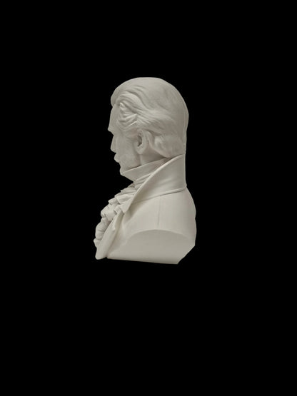 A white resin or ceramic bust sculpture of a historical man in profile, shown on a textured white surface against a white background.