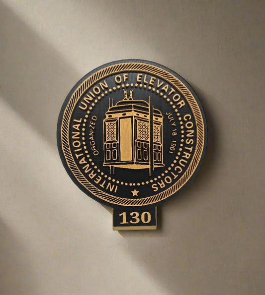 Decorative plaque with elevator design on a white wall
