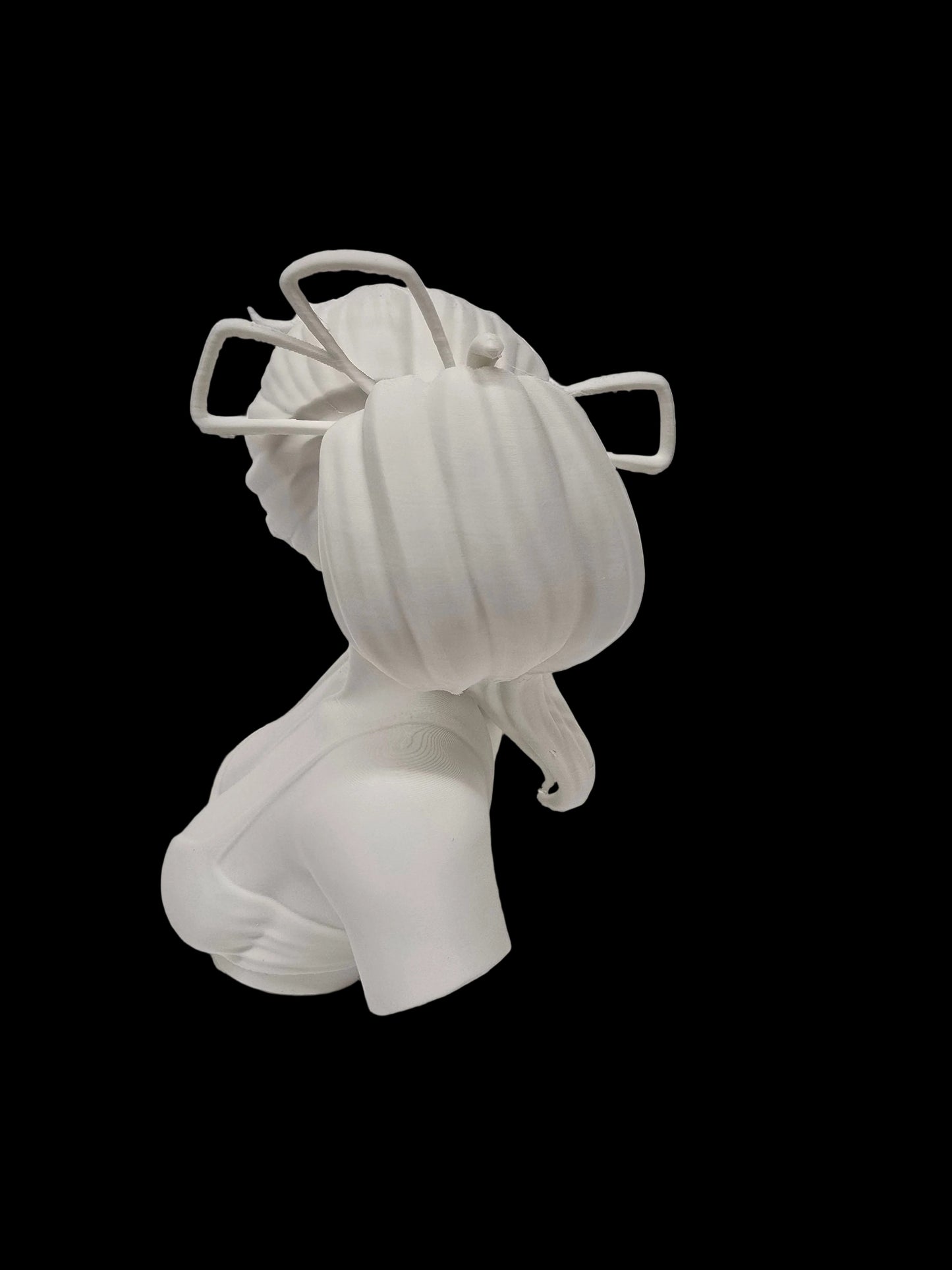A white 3D-printed female bust sculpture with a stylized pumpkin head and geometric hair accessories, shown from the back against a textured white background.