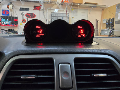 Digital speedometer and tachometer display on a car dashboard with a garage background.