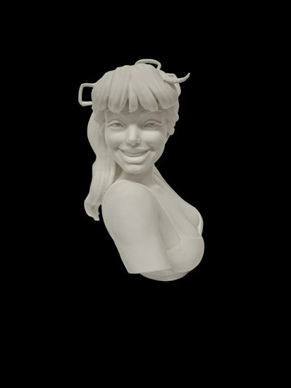 A white 3D-printed female bust sculpture with a smiling expression, styled with a cowgirl hat and a halter-style top, set against a textured white background.