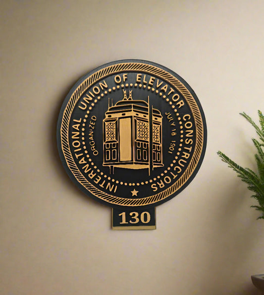 Decorative plaque with gold text and design on a beige background