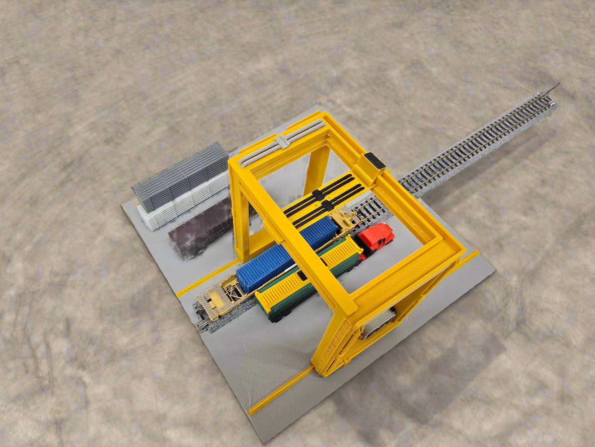Model of a yellow industrial crane on a white surface
